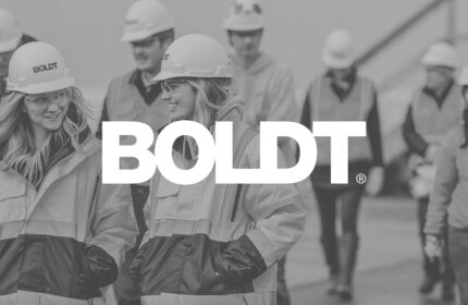  Logo on Black-and-white Image of  Employees in Safety Apparel and Hard Hats